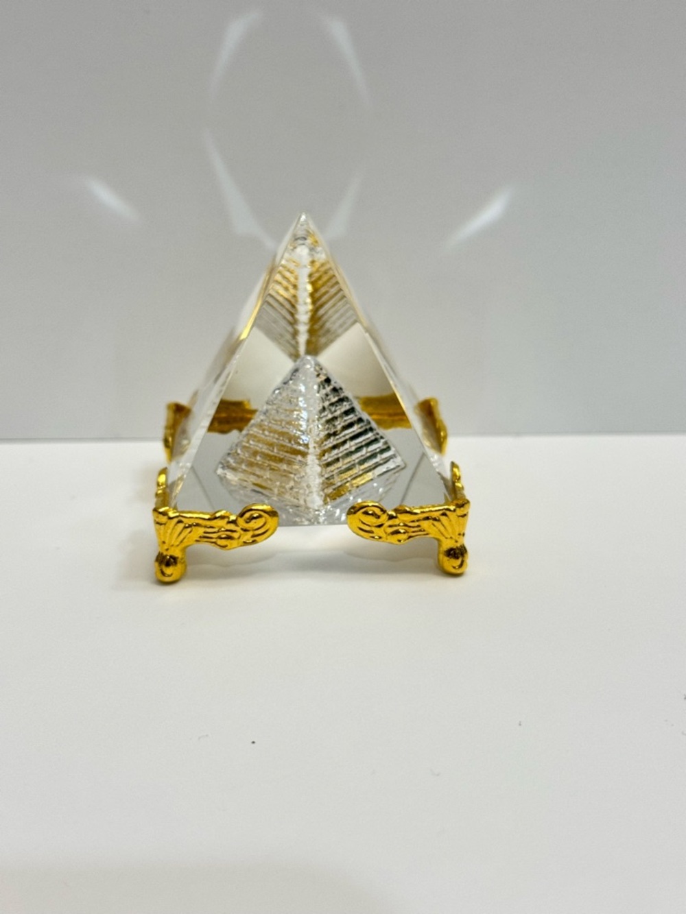 Clear Glass Pyramid Paperweight on Ornate Gold Stand